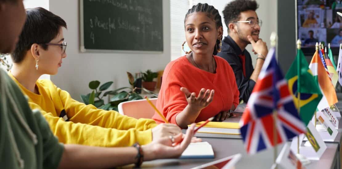 Multicultural Students Chatting in Class
