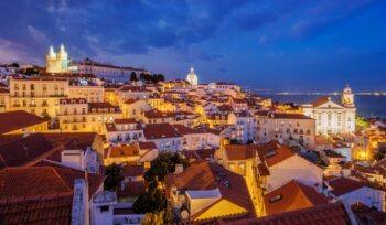 View of Lisbon from Miradouro de Santa Luzia viewpoint at evening. Lisbon, Portugal, Investment Fund,