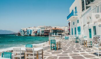 white and brown concrete buildings near sea in Greece.